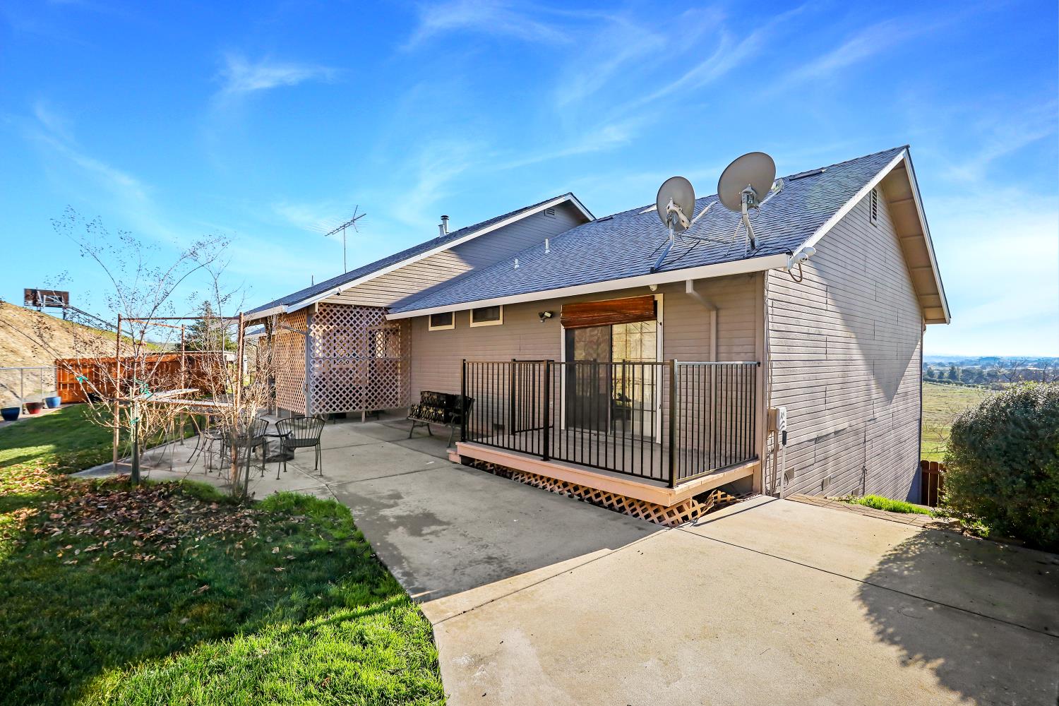 2 Katelyn Court Valley Springs, CA 95252 - Photo 58 of 98 a view of a house with a yard and table and chairs