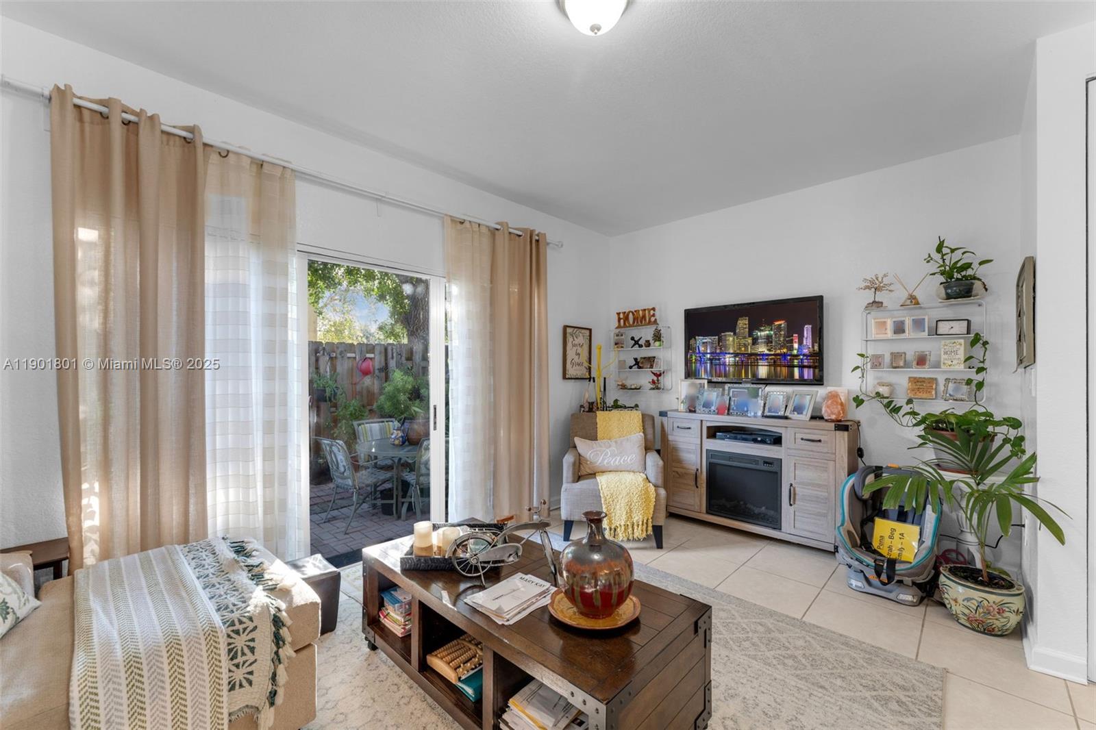 1595 Northeast 33rd Road, Unit 1123 Homestead, FL 33033 - Photo 11 of 34 a living room with furniture and a wooden floor