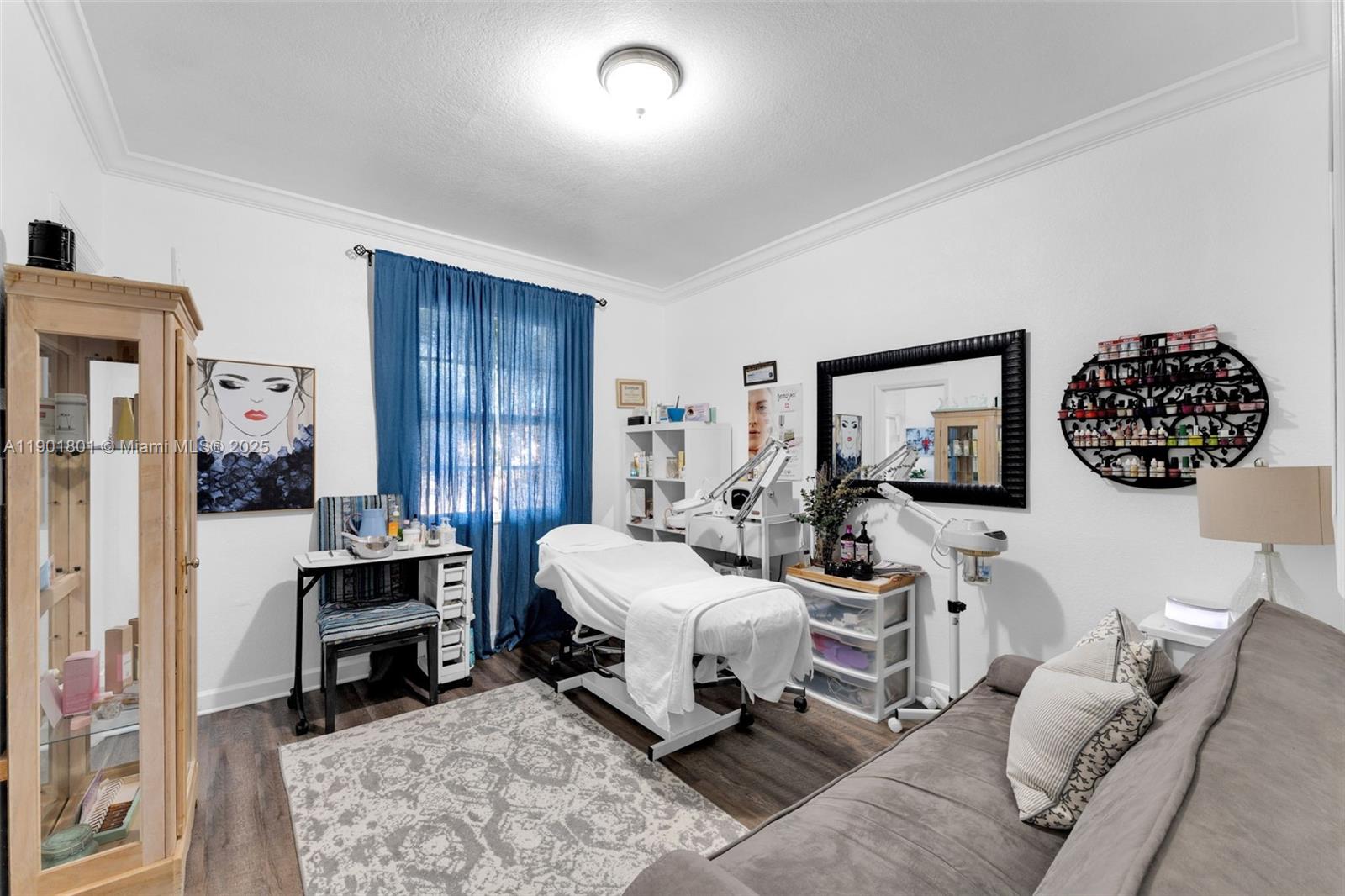 1595 Northeast 33rd Road, Unit 1123 Homestead, FL 33033 - Photo 14 of 34 a living room with furniture and a lamp