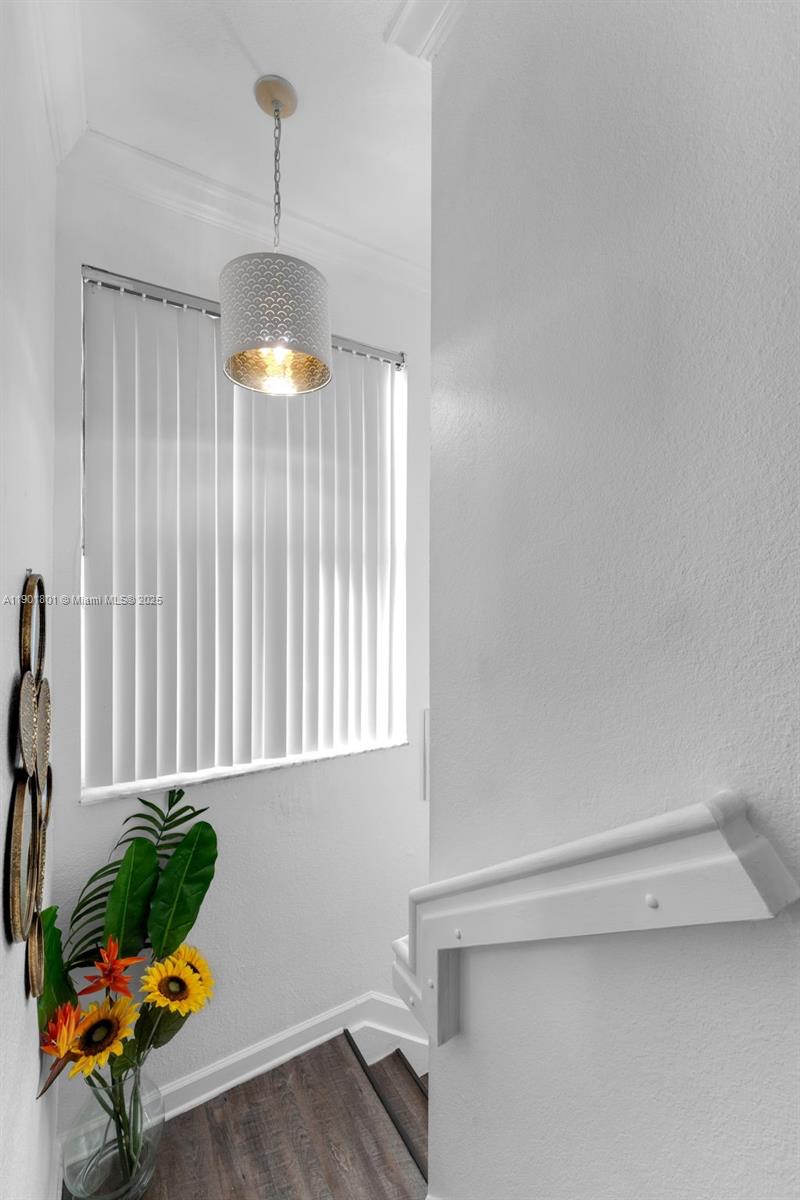 1595 Northeast 33rd Road, Unit 1123 Homestead, FL 33033 - Photo 22 of 34 a room with a window and a potted plant