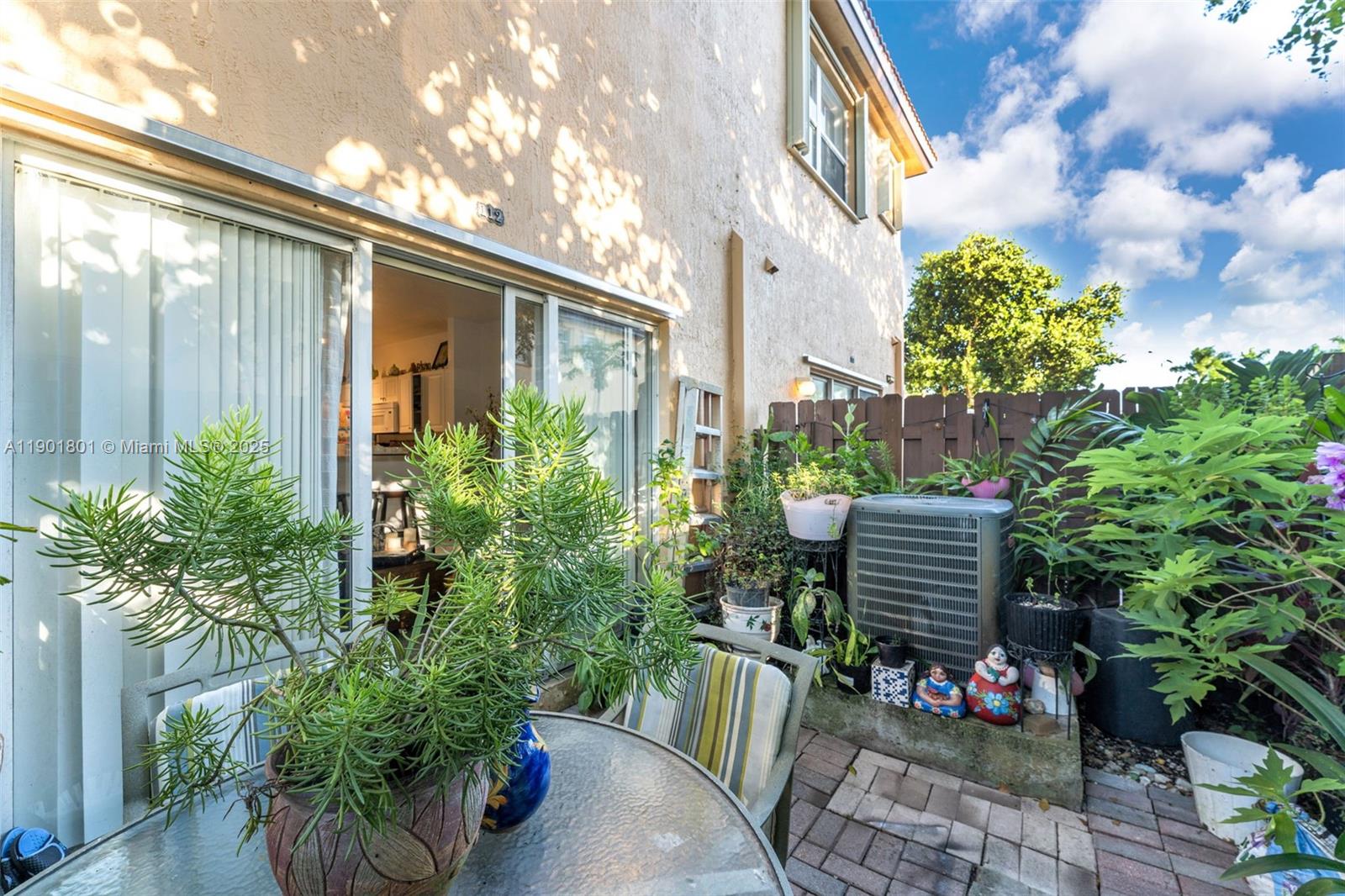 1595 Northeast 33rd Road, Unit 1123 Homestead, FL 33033 - Photo 24 of 34 a backyard of a house with lots of green space