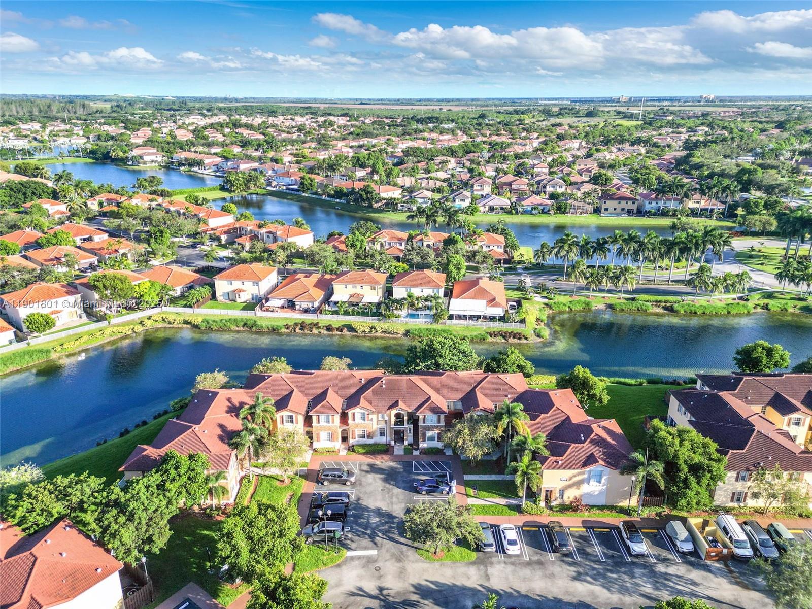 1595 Northeast 33rd Road, Unit 1123 Homestead, FL 33033 - Photo 26 of 34 an aerial view of lake and city space