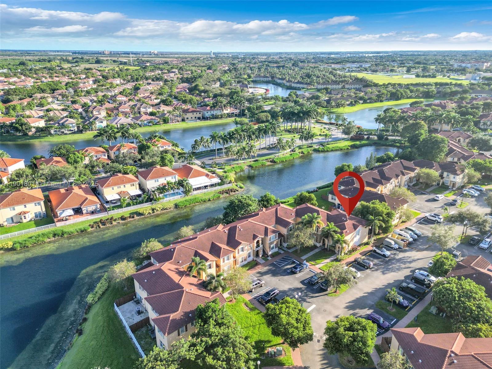 1595 Northeast 33rd Road, Unit 1123 Homestead, FL 33033 - Photo 27 of 34 an aerial view of lake and city