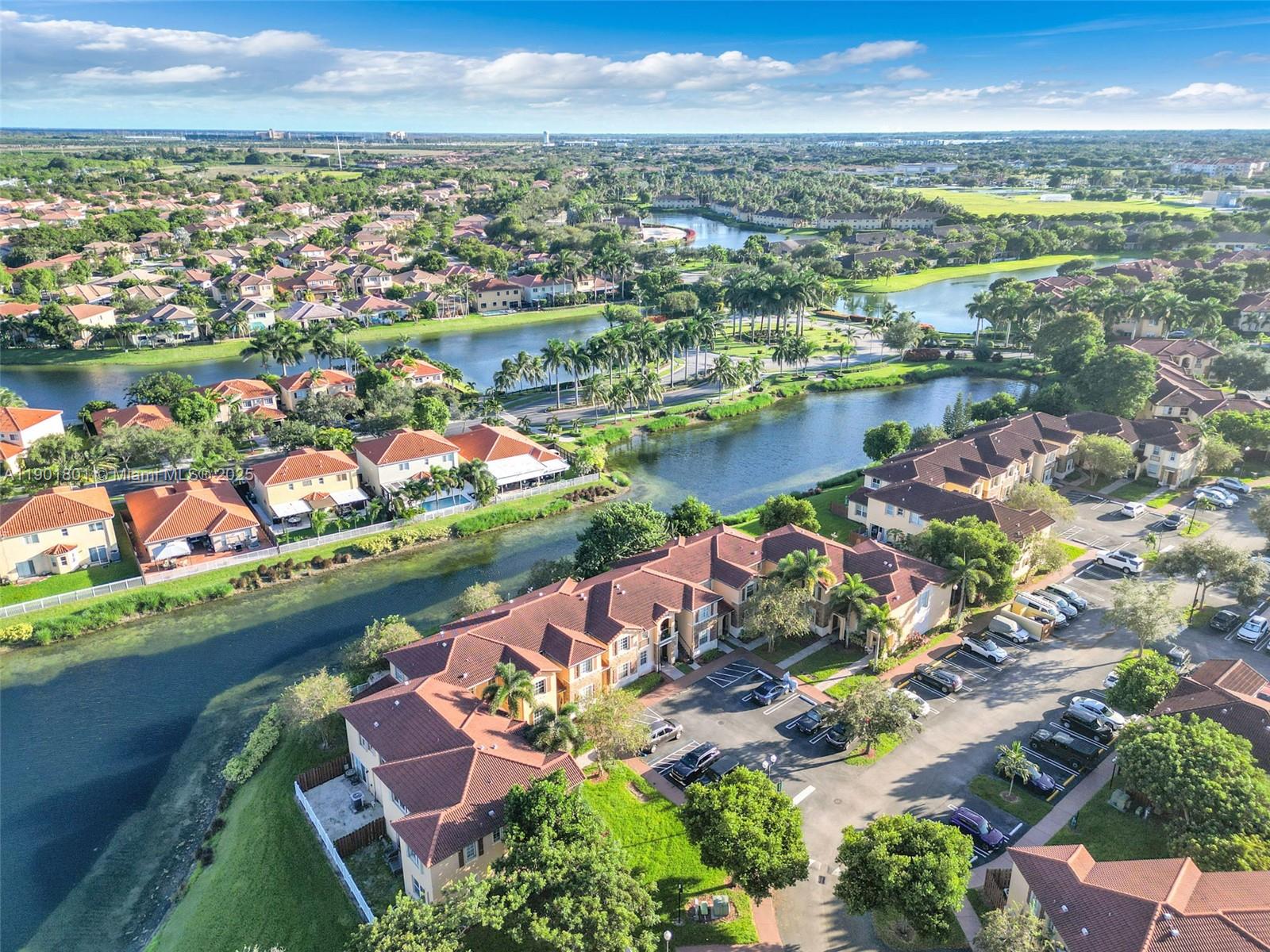 1595 Northeast 33rd Road, Unit 1123 Homestead, FL 33033 - Photo 28 of 34 an aerial view of lake and city