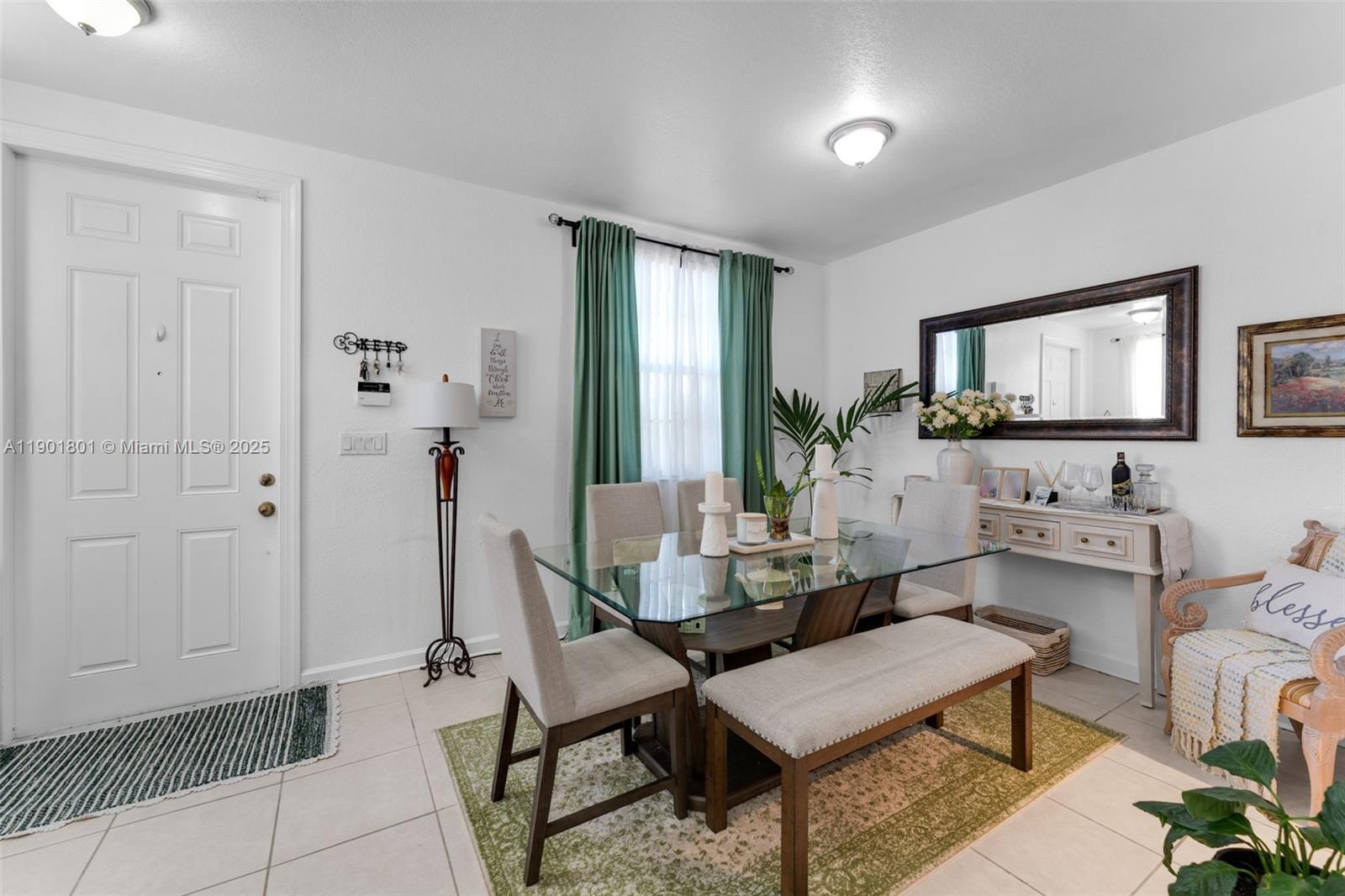 1595 Northeast 33rd Road, Unit 1123 Homestead, FL 33033 - Photo 5 of 34 a living room with furniture and a flat screen tv