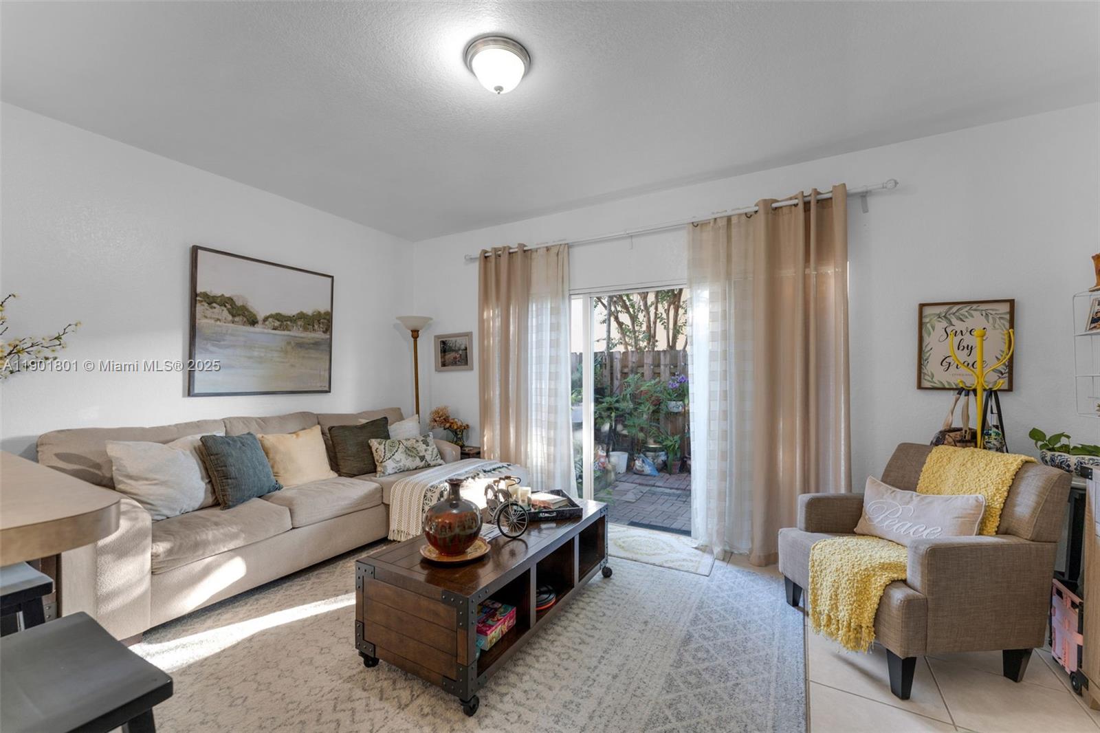 1595 Northeast 33rd Road, Unit 1123 Homestead, FL 33033 - Photo 9 of 34 a living room with furniture and a large window