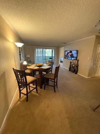 a view of a livingroom with furniture and a window