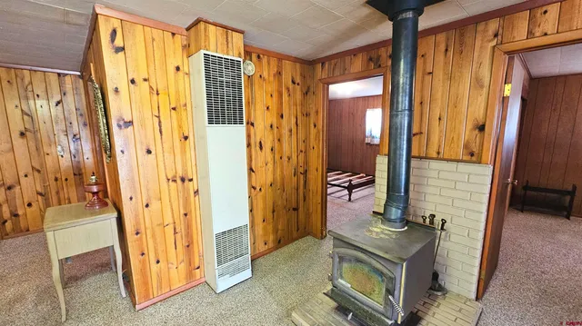 a view of walk in closet with large mirror