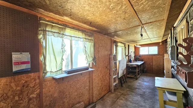 a room with furniture and a window