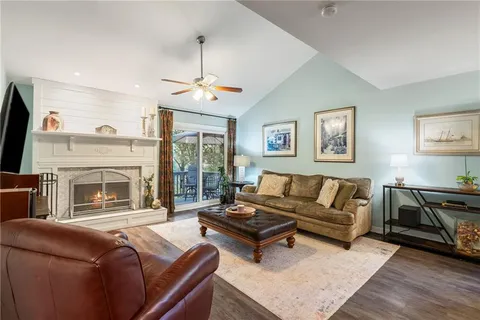 a dining room with furniture window and wooden floor