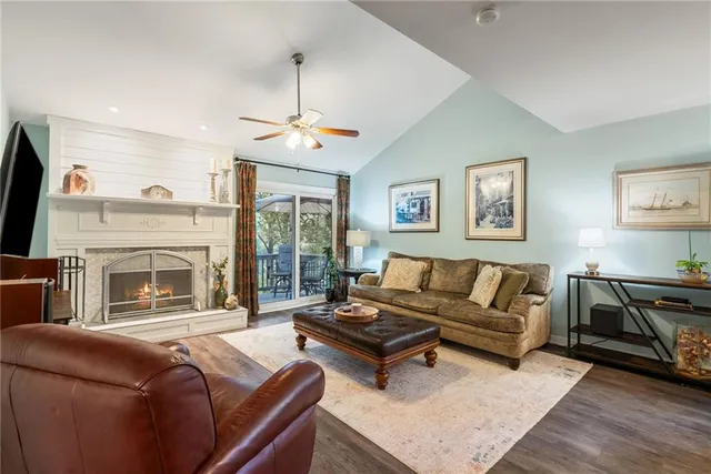 a dining room with furniture window and wooden floor
