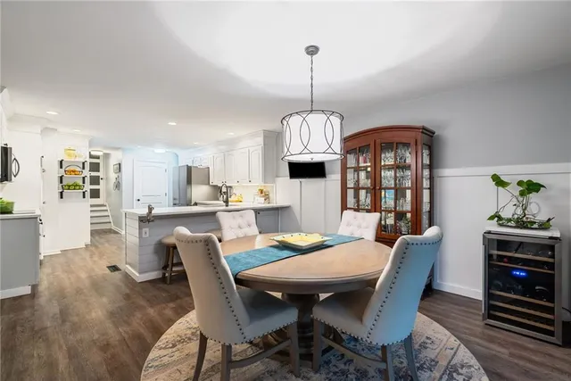 a kitchen with stainless steel appliances a stove microwave and cabinets