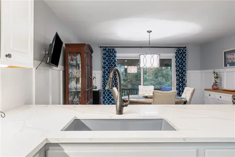 a view of balcony with furniture and umbrella