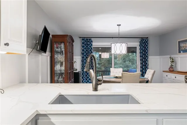 a view of balcony with furniture and umbrella