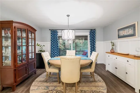 a spacious bathroom with a double vanity sink a mirror and a shower