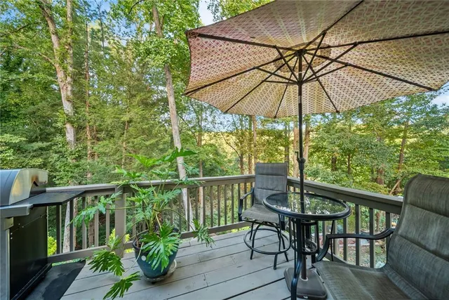 a bedroom with a bed and a flat tv screen on dresser