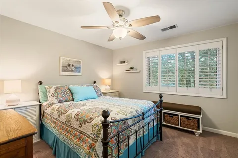 a view of a kitchen with a sink and cabinets