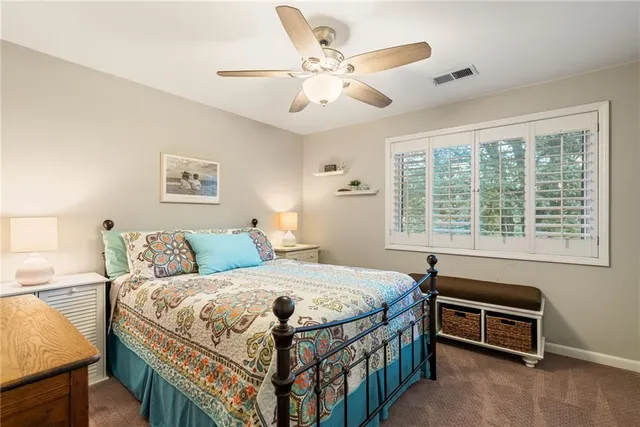 a view of a kitchen with a sink and cabinets