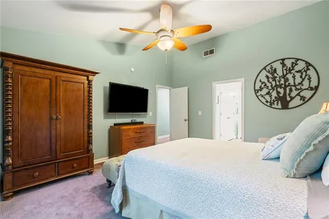 a view of a livingroom with furniture and a window
