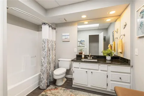 a view of a green field with lots of bushes