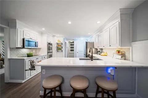a view of a front door and wooden floor