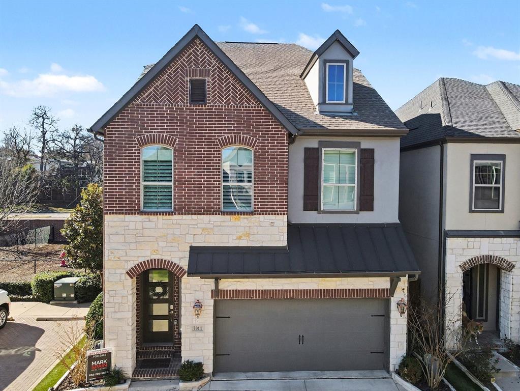 a front view of a house with many windows