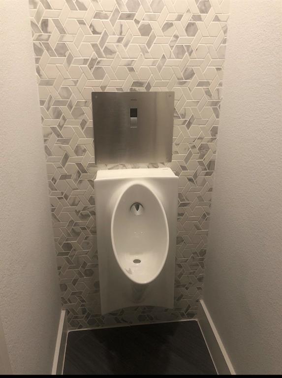 7011 Mistflower Ln. Dallas, TX 75231 - Photo 12 of 22 a bathroom with a sink and a mirror