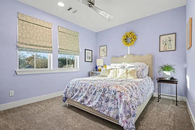 a bedroom with a bed and a table