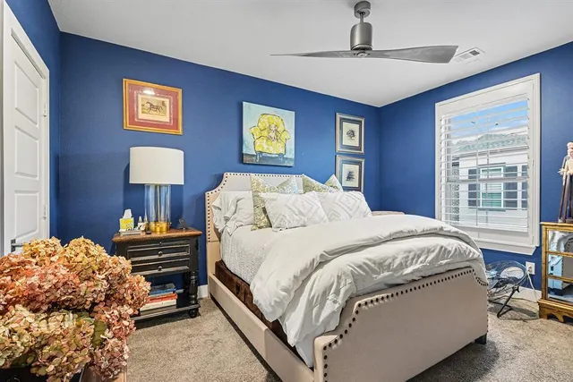 a bedroom with a bed and a table