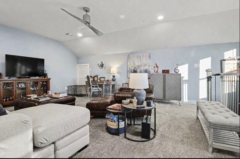 7011 Mistflower Ln. Dallas, TX 75231 - Photo 16 of 22 a living room with furniture and a flat screen tv