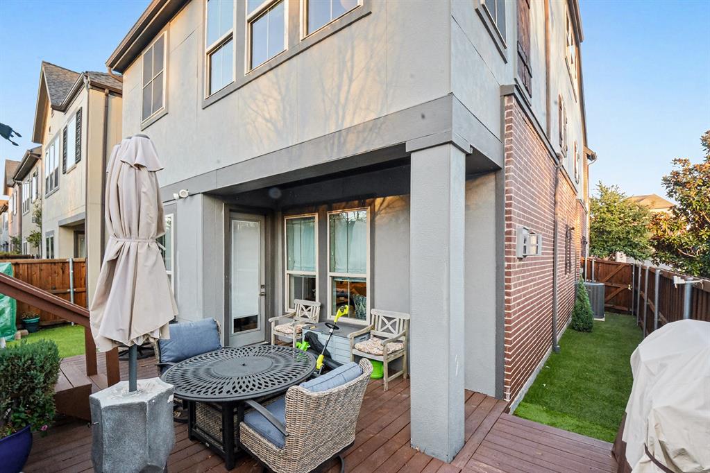 7011 Mistflower Ln. Dallas, TX 75231 - Photo 18 of 22 a view of a patio with couple of chairs and a fountain