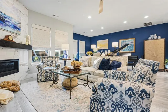 a living room with furniture fireplace and a fireplace