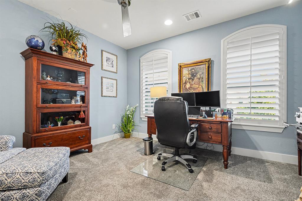 7011 Mistflower Ln. Dallas, TX 75231 - Photo 9 of 22 a view of a workspace with furniture and a window