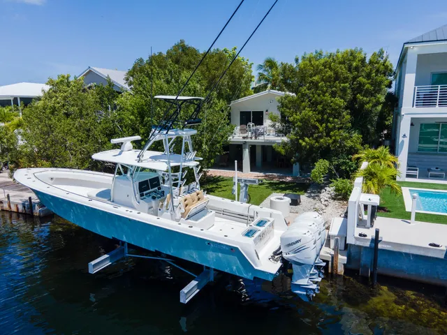 a view of a patio with table and chairs and potted plants