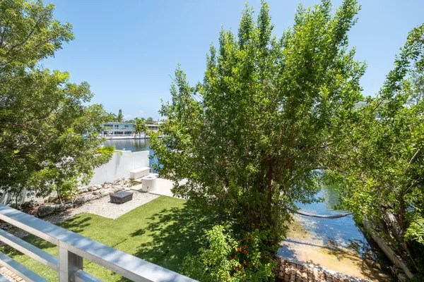 a kitchen with a refrigerator a stove top oven a sink and cabinets