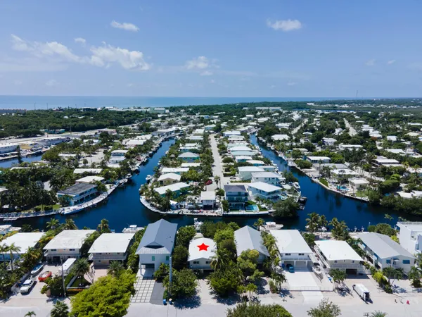 a view of house with outdoor space and trees
