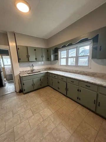 a large kitchen with a large window
