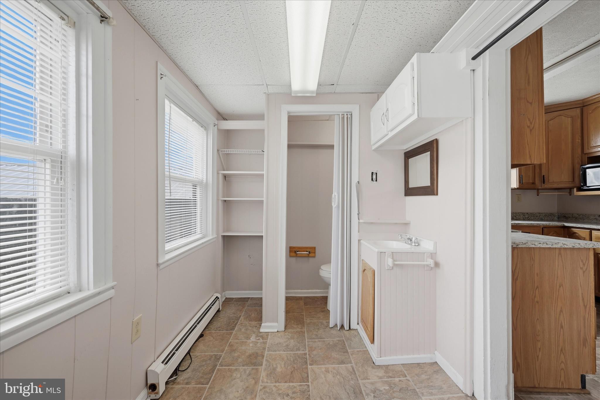 508 Dunlap Street Winchester, VA 22601 - Photo 5 of 15 1/2 Bathroom in Laundry Area off Kitchen