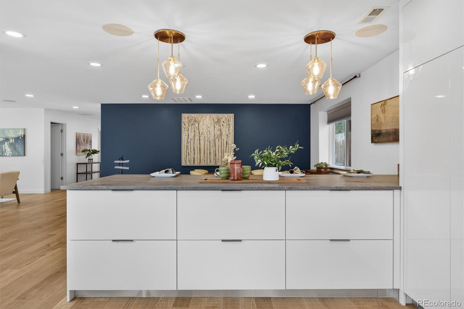 765 Kearney Street Denver, CO 80220 - Photo 16 of 35 a kitchen with stainless steel appliances granite countertop a sink and a refrigerator