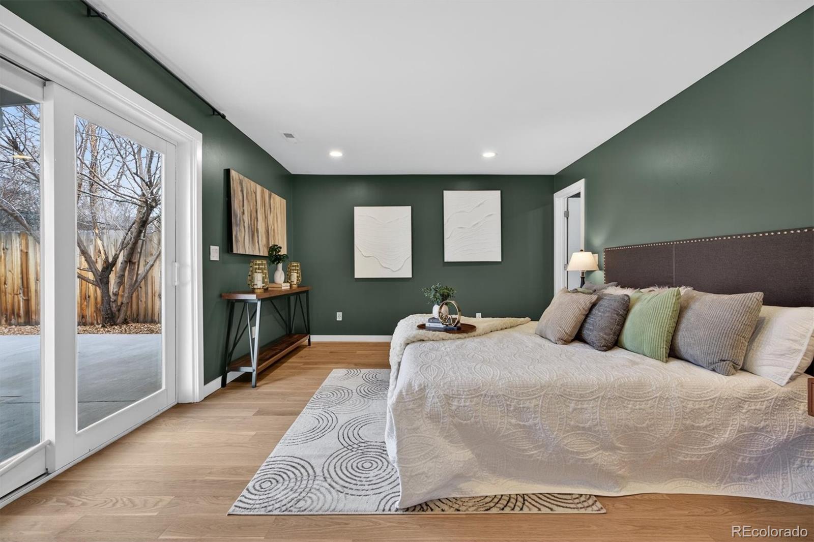 765 Kearney Street Denver, CO 80220 - Photo 22 of 35 a bedroom with a large bed and a large window