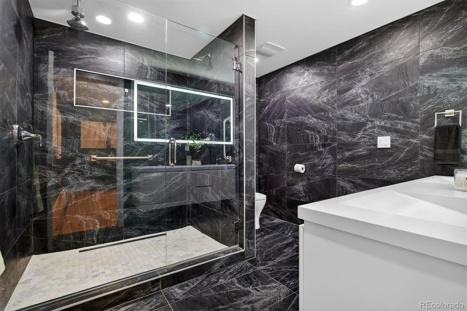 765 Kearney Street Denver, CO 80220 - Photo 24 of 35 a bathroom with a shower