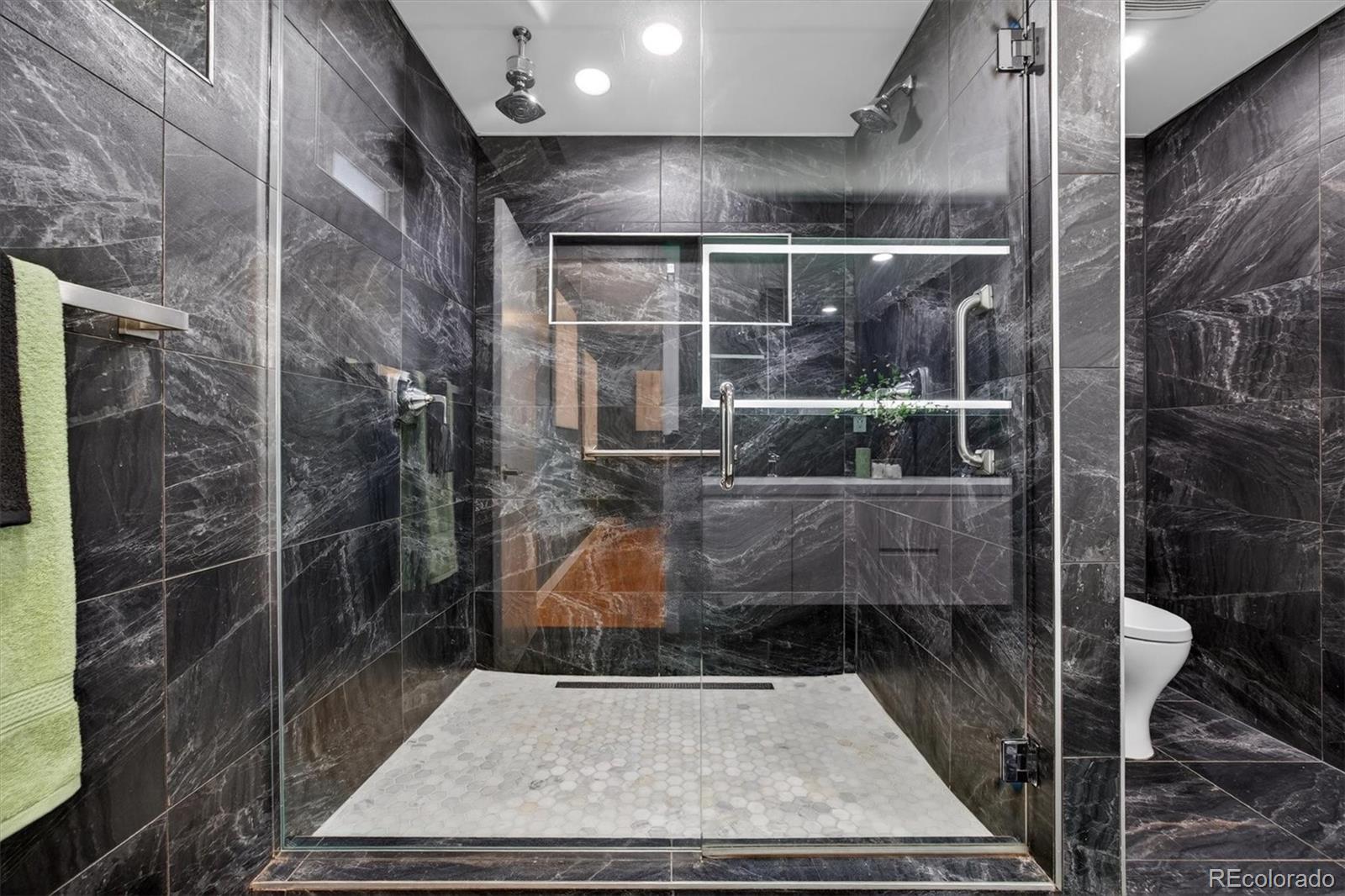765 Kearney Street Denver, CO 80220 - Photo 27 of 35 a bathroom with a shower