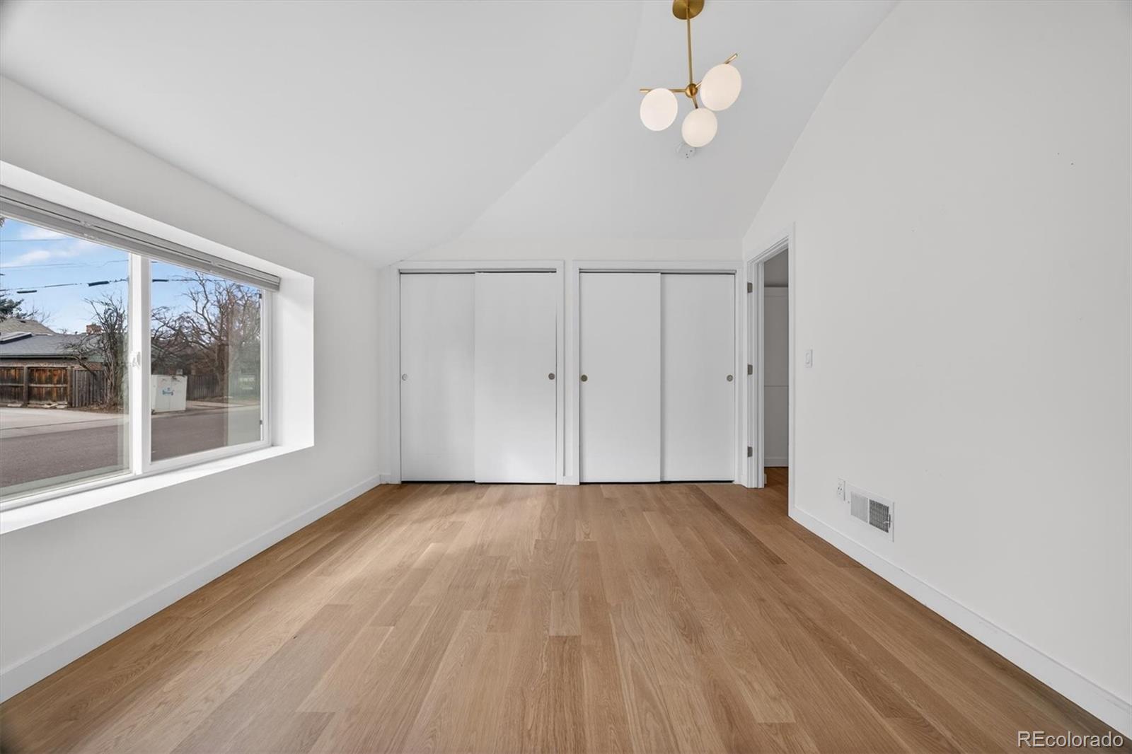 765 Kearney Street Denver, CO 80220 - Photo 29 of 35 wooden floor in an empty room with a window