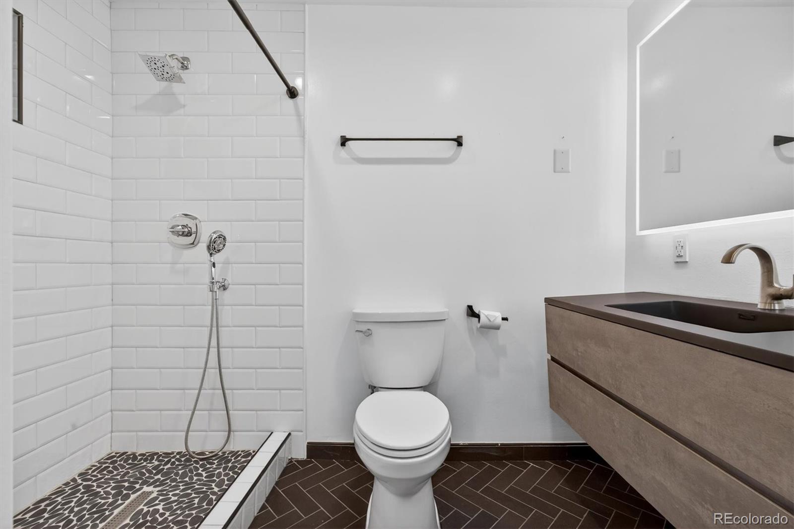 765 Kearney Street Denver, CO 80220 - Photo 30 of 35 a bathroom with a sink toilet and shower