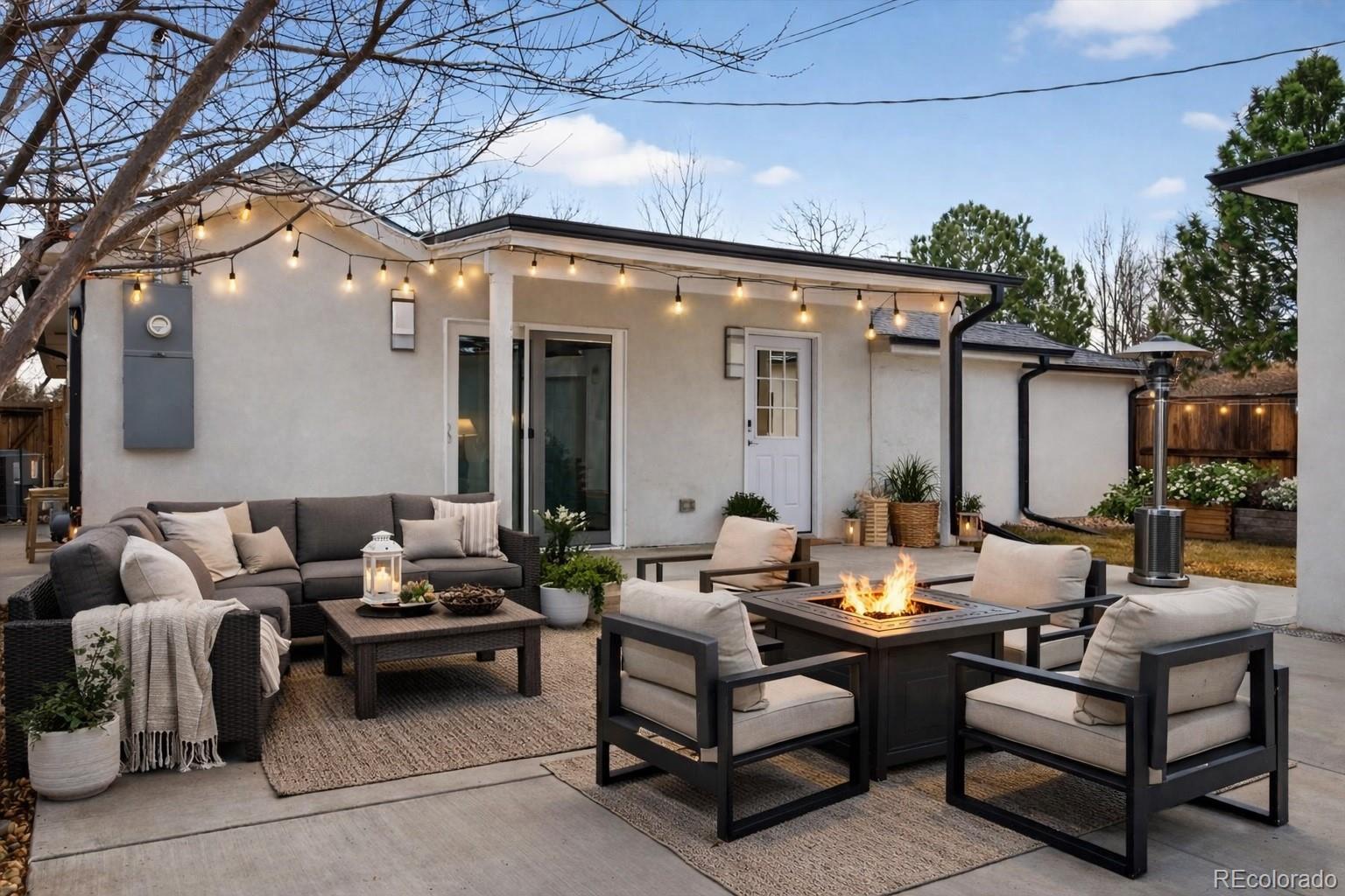 765 Kearney Street Denver, CO 80220 - Photo 31 of 35 a outdoor space with patio couches and a potted plant