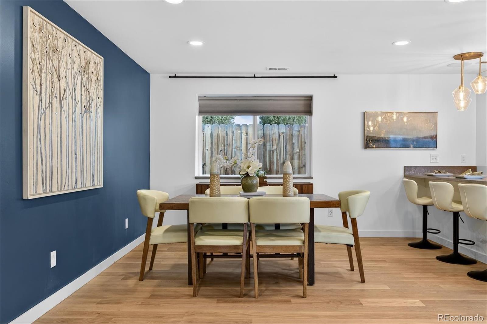 765 Kearney Street Denver, CO 80220 - Photo 7 of 35 a view of a dining room with furniture window and wooden floor