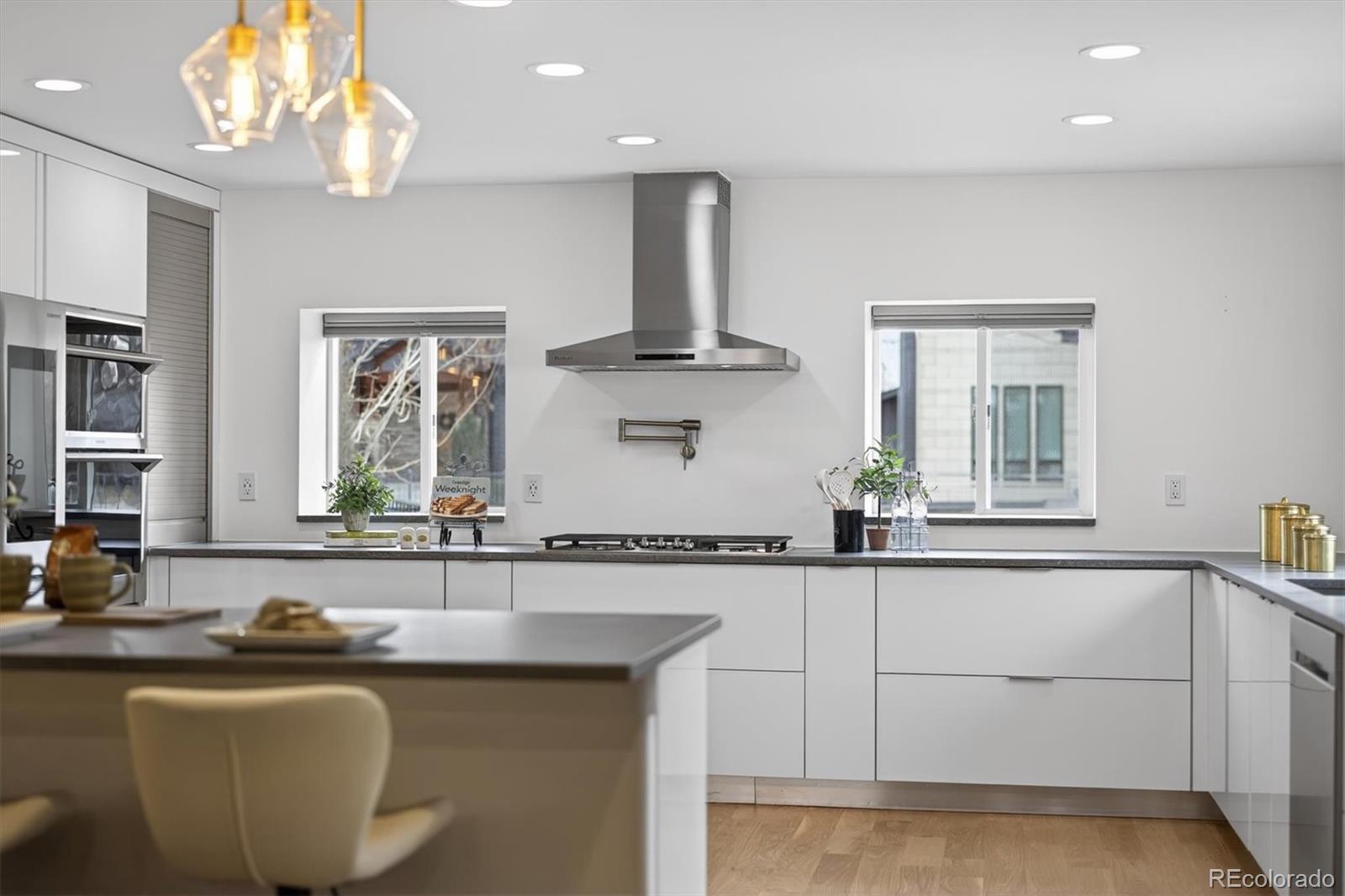 765 Kearney Street Denver, CO 80220 - Photo 10 of 35 a kitchen with a sink and chandelier