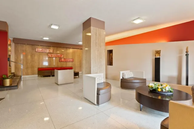 a lobby with furniture and tables