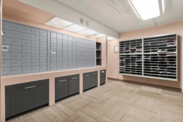 a spacious bathroom with a granite countertop sink and a bathtub