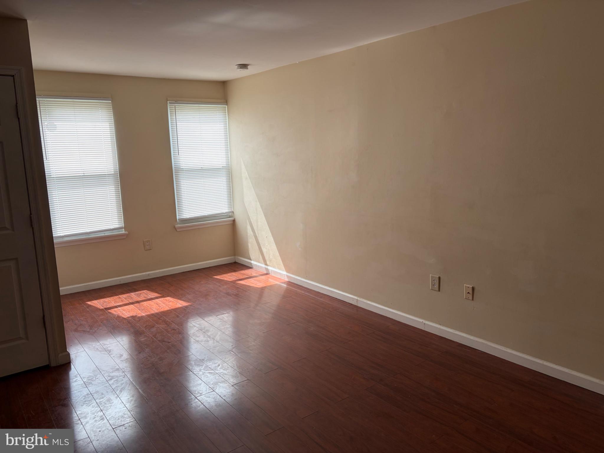 3273 Red Lion Road Philadelphia, PA 19114 - Photo 3 of 9 an empty room with wooden floor and windows